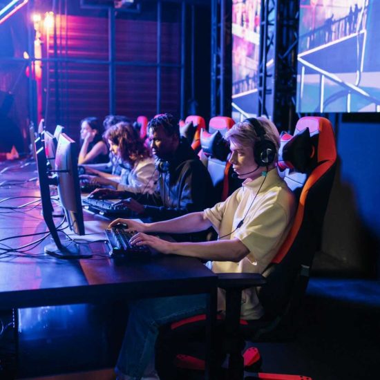 A team of gamers immersed in an e-sports competition, showcasing teamwork and focus.